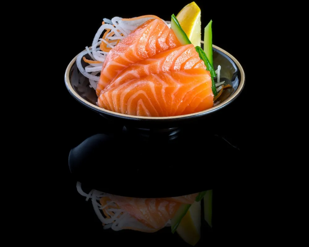 Fresh salmon sashimi served over shredded radish at Sushi & Maki, a Japanese Restaurant in Portland.